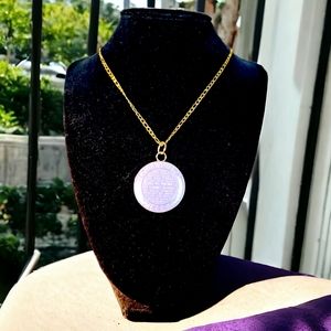 Round charm- upcycled- reworked on a stainless steel gold plated necklace.